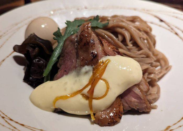 A close-up shot of duck tsukemen at Gion Duck Noodles.